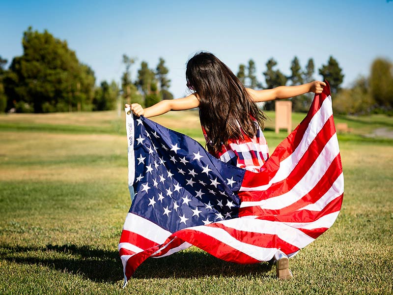 Girl Running with USA Flag