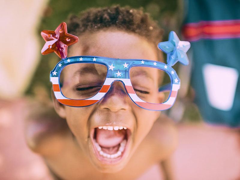 Child Wearing USA Flag Branded Glasses